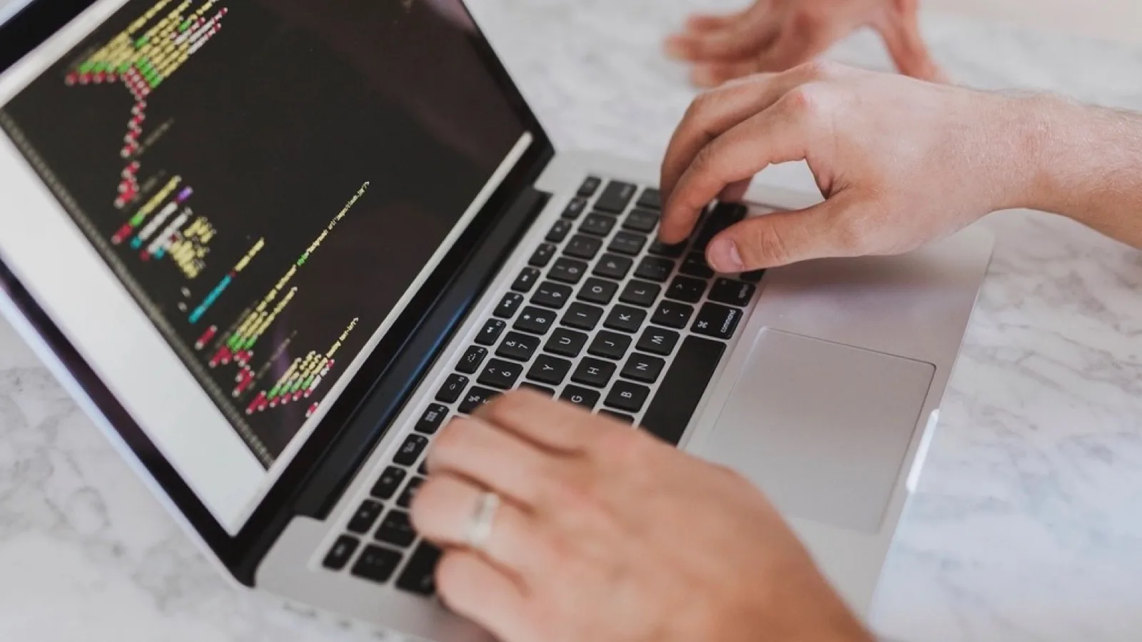 Writing code on a laptop