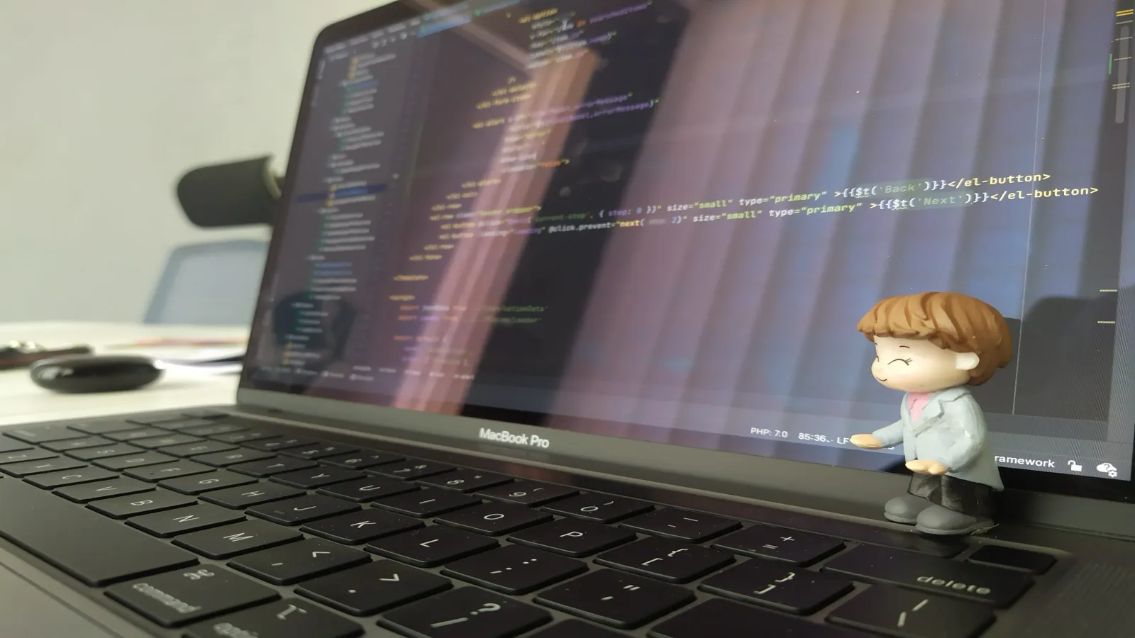 Writing code on a laptop
