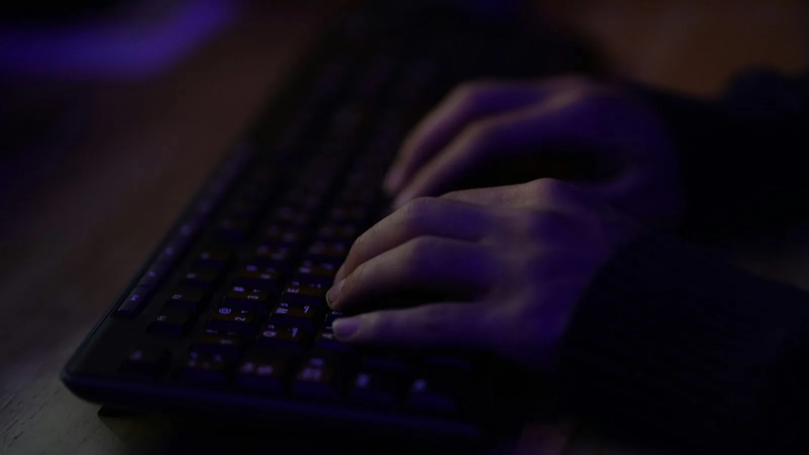 Hands on a keyboard at work